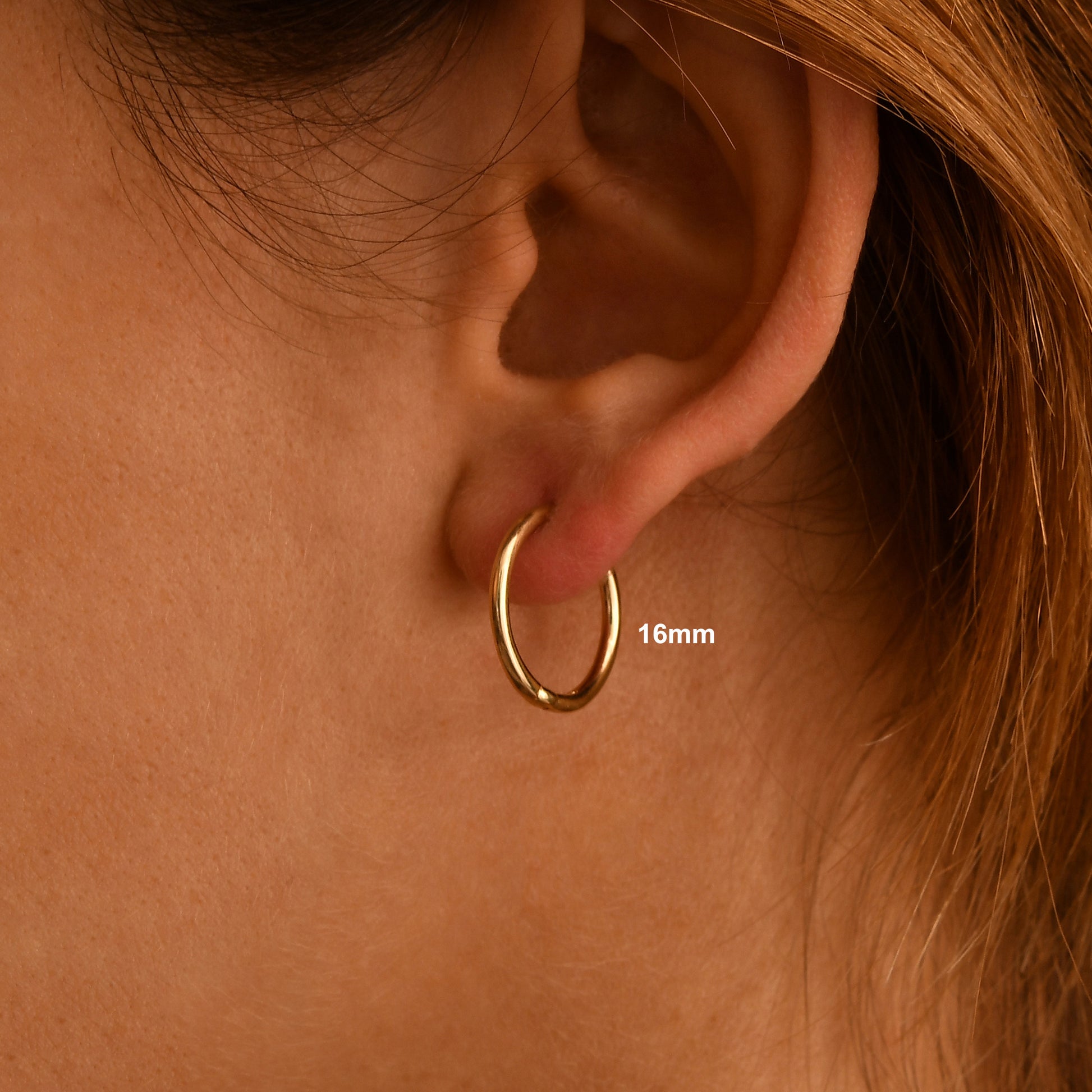 These handmade solid gold hoop earrings are designed for effortless everyday wear.