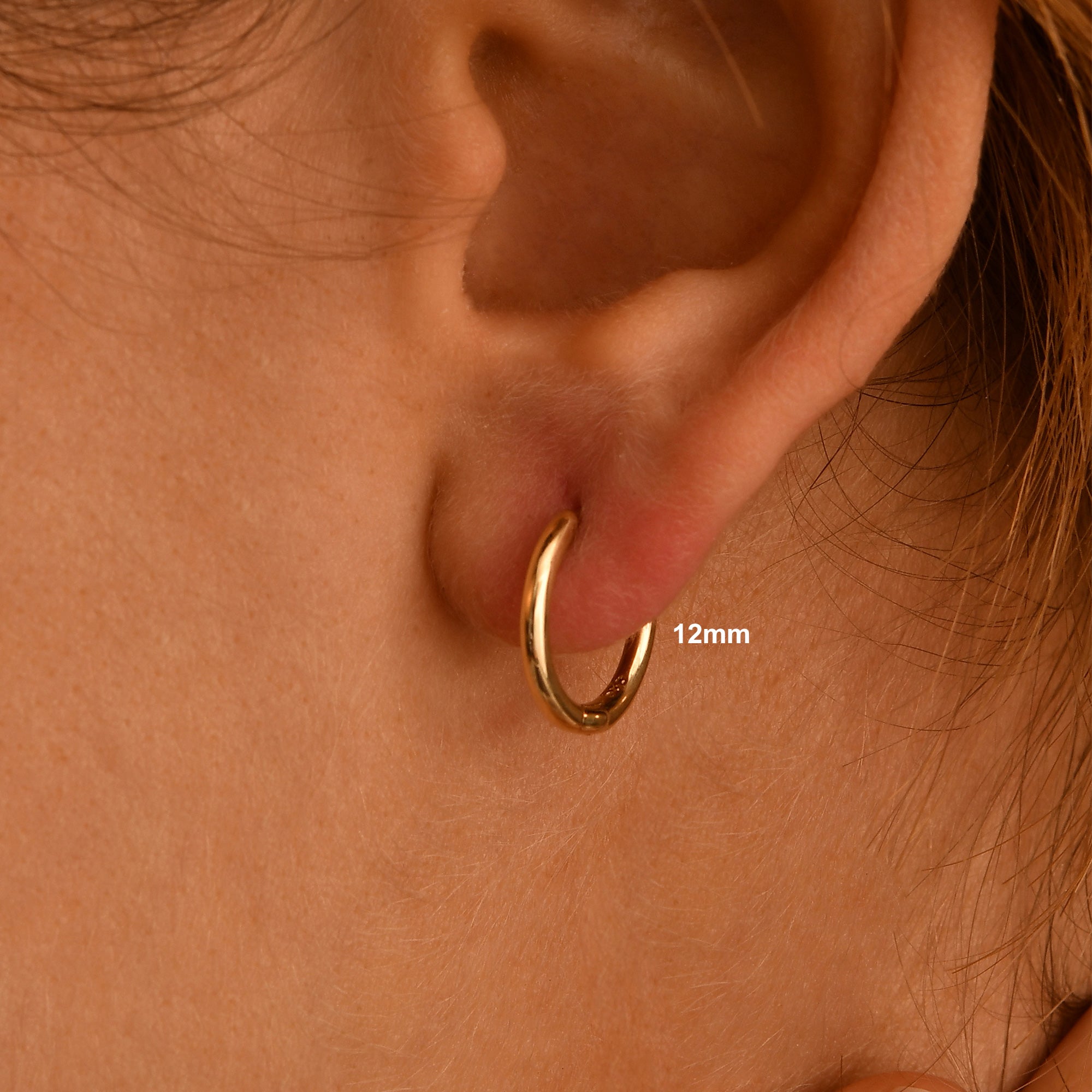 These handmade solid gold hoop earrings are designed for effortless everyday wear.