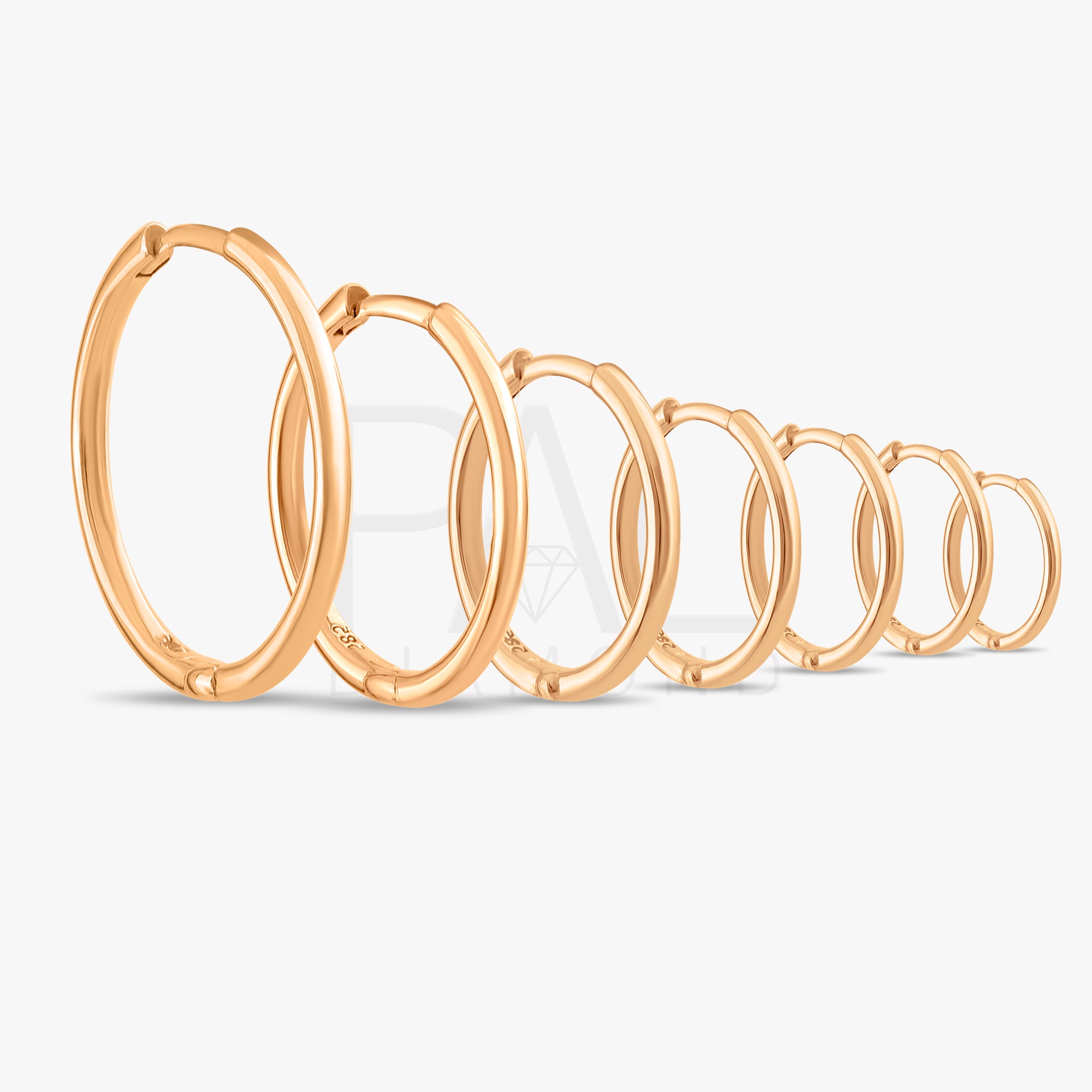 These handmade solid gold hoop earrings are designed for effortless everyday wear.