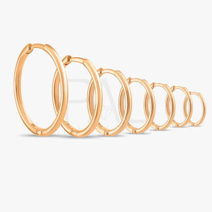 These handmade solid gold hoop earrings are designed for effortless everyday wear.