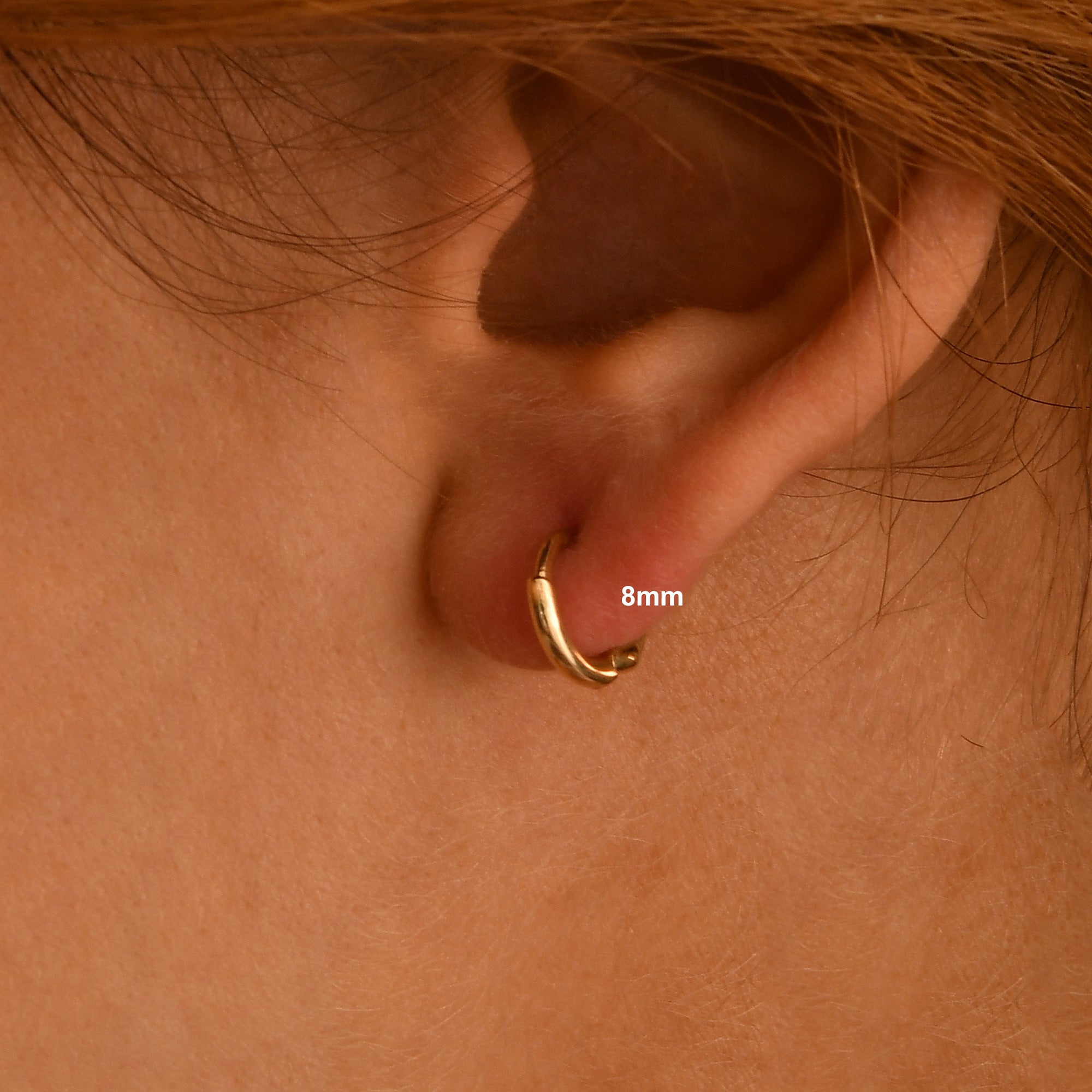 These handmade solid gold hoop earrings are designed for effortless everyday wear.